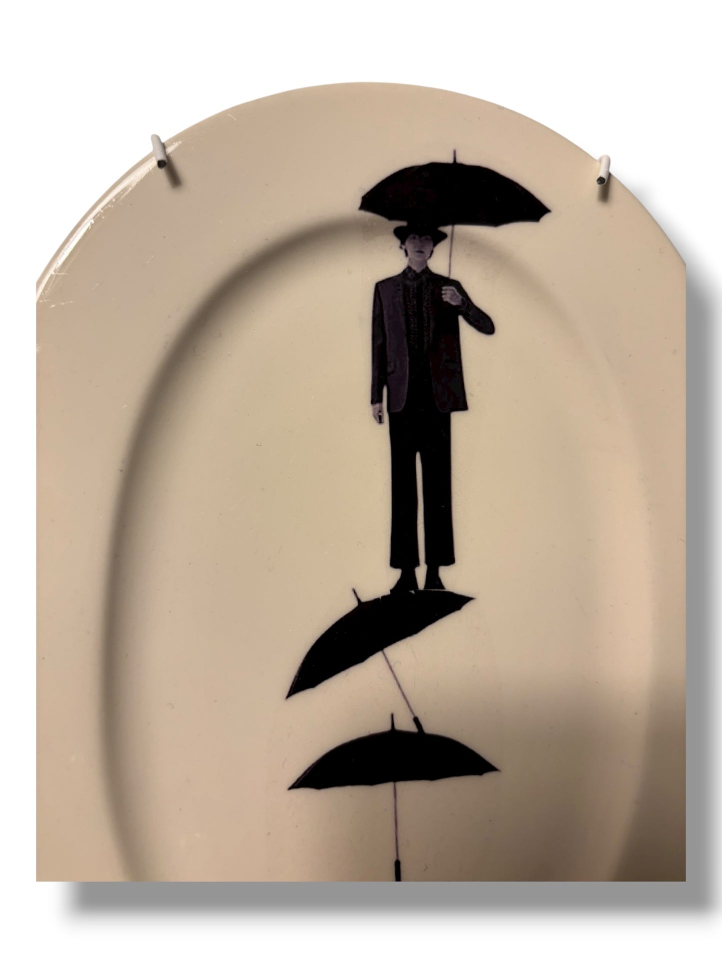Vintage Wandbord Ovaal Man op Paraplu